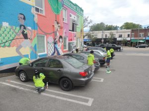 Detailers cleaning cars