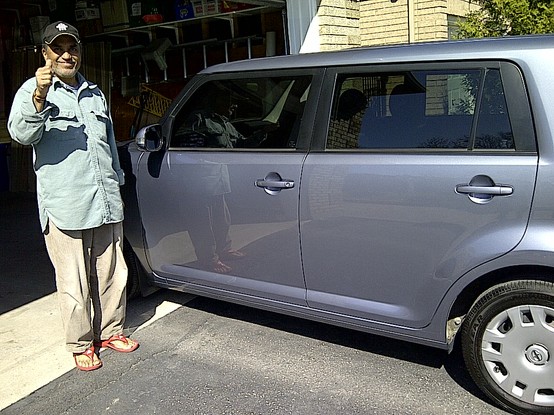 Dad posing with his car